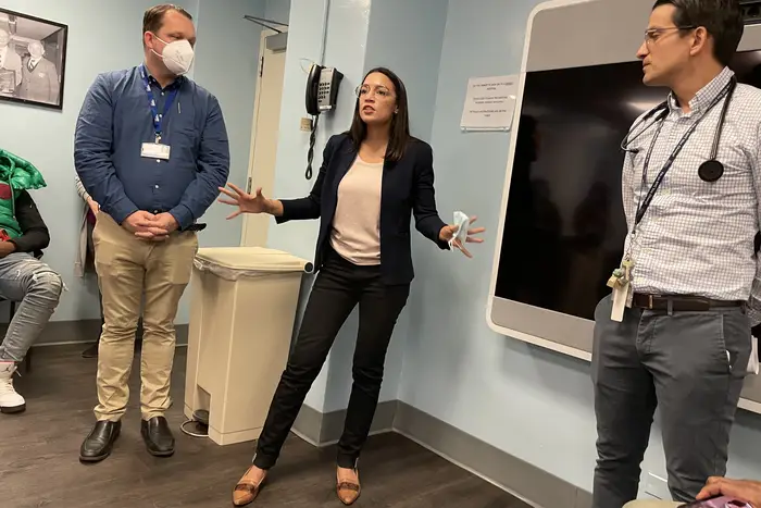 Bronx Rep. Alexandria Ocasio-Cortez speaks with staffers from Stand Up to Violence at Jacobi Hospital.